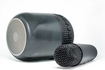 Wireless portable speaker with microphone for karaoke on white background, product photography...
