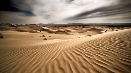 Naklejka premium Rolling Sand Dunes Under a Cloudy Sky