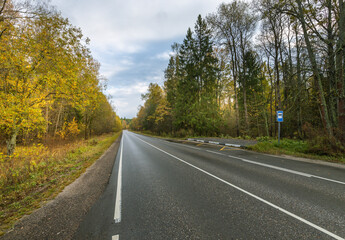 A road with a blue sign on it