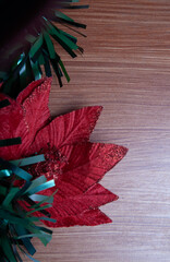 Christmas decoration detail. Red and gold Christmas decorations such as ribbon, fir branches, pine cones and Christmas tree. Background.