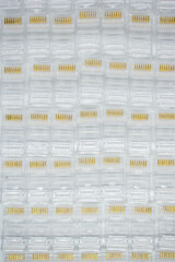 Zenithal view of many RJ-45 network connectors. Communication and computer network concept, selective focus