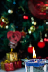 Christmas decoration detail. Red and gold, decorations such as ribbon, fir branches and pine cones.