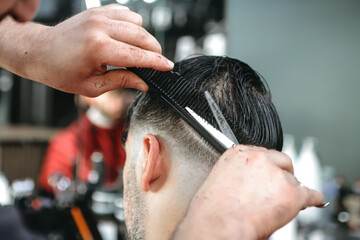 Naklejka premium a man in barber, haircut, barber, hair style