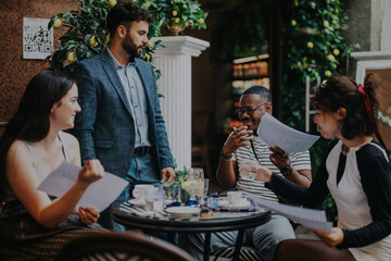 A diverse group of professionals engage in a lively meeting, discussing ideas and strategies while enjoying a vibrant coffee shop atmosphere. Teamwork and collaboration are evident in this dynamic