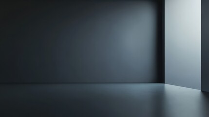 Empty modern space with dark walls and a single light source, perfect for showcasing minimalism and contrast in design.