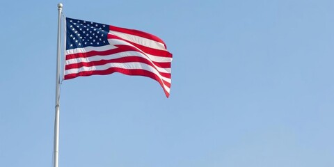 A flagpole with the American flag proudly waving in the wind, patriotism, freedom, national pride