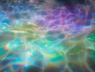 Captivating abstract illustration featuring iridescent ripples and overlapping bubbles in soft hues of blue, rainbow, and white. The design evokes a dreamy, fluid, and ethereal underwater atmosphere.