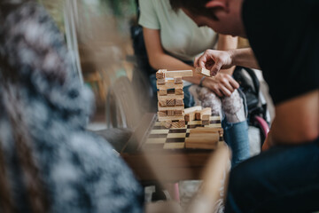 A boy with Down syndrome, a girl in a wheelchair, and an elderly woman engage in a collaborative...