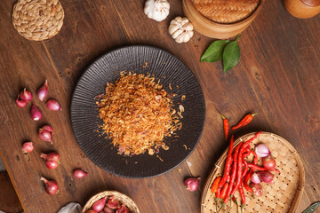 Fried shallots in a jar with a darkmood photo concept and onion photo display