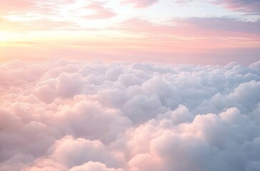 A breathtaking view of fluffy white clouds illuminated by a warm sunset.