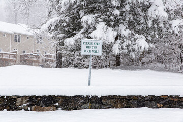 snow covered road sign