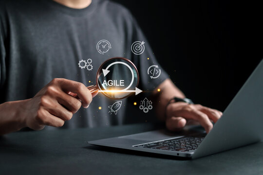 Agile development methodology concept, Person using laptop with agile icons on virtual screen. Iterative methods. reducing step by step work and focusing on team.