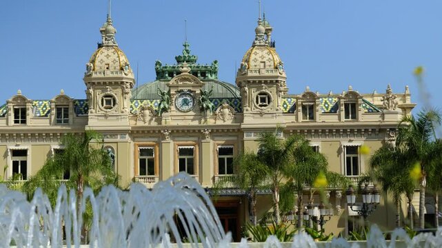 Low angle shot of the Monte Carlo Casino from behind a water fountain