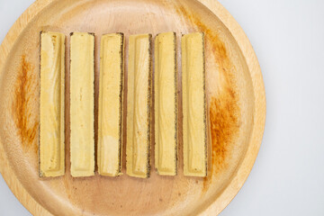 Cereal wafer sticks in a wooden plate