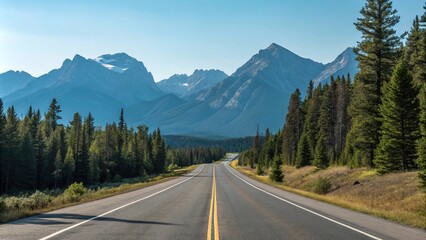 Fototapeta premium Empty stretch of asphalt road running parallel to a mountain range with a clear blue sky above and pine trees in the foreground, mountain view, peaceful scene