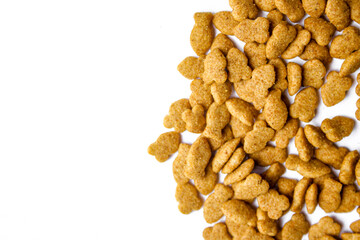 Scattered dry cat food isolated on white background