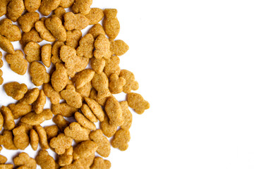 Scattered dry cat food isolated on white background