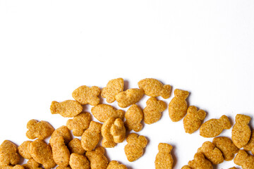 Scattered dry cat food isolated on white background