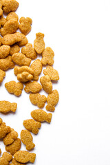 Scattered dry cat food isolated on white background