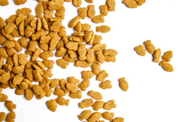 Scattered dry cat food isolated on white background