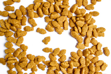 Scattered dry cat food isolated on white background