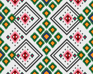 Vibrant geometric pattern featuring colorful diamonds and shapes in red, green, and yellow. This design adds lively touch to any textile or wallpaper