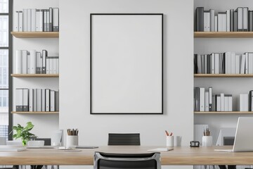 A modern office interior with a large blank poster frame on the wall, two desks, and a potted plant.