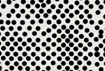 A black background with white polka dots in a random pattern