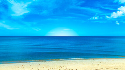 Nature of the beach and sea Summer with sunshine, sandy beaches, clear blue waters sparkling against the blue sky. On an island with good ecology and environment Background for summer vacation concept