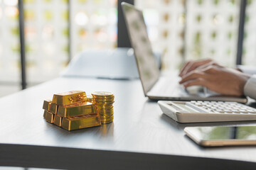 Gold Trading business man hand offering gold Investment in gold mining company or Trading gold on the stock exchange Rising gold prices.