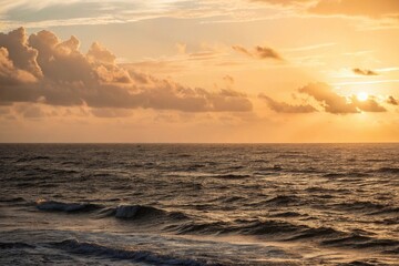 Obraz premium Golden hour casting warm light over vast black ocean, black ocean, golden hour, natural beauty, sunset, peaceful atmosphere