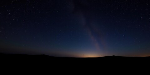 Star-filled night sky with shooting stars streaking across the horizon, stellar streaks, sparkling stars, starry light show