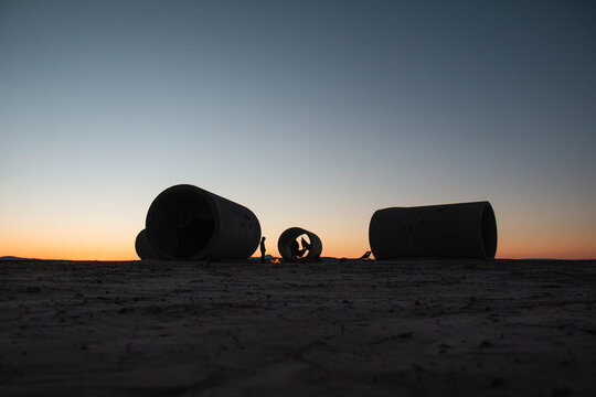 Sunset at cement sun tunnels in Utah desert
