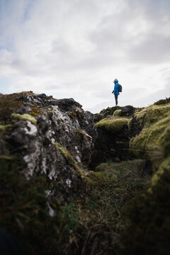 Woman standing over green canyon in Iceland