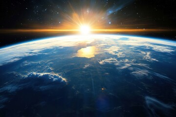 Fototapeta premium A stunning sunrise over Earth as seen from space, with a bright sun shining over the horizon.