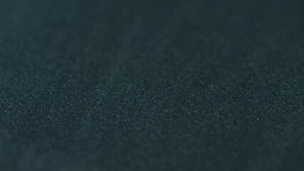 Paint grain texture. Ink blend. Black blue color gradient glitter sand particles beautiful surface art design on abstract background.