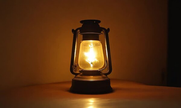 Old oil lantern flowing on a dark background