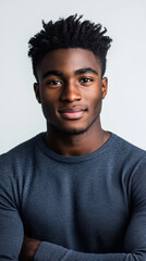 Obraz premium Attractive young man with confident smile on white backdrop