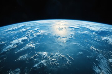 Earth from space, showing clouds, atmosphere, and a blue ocean.