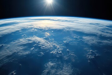 Earthrise seen from space with sunbeams shining through clouds.