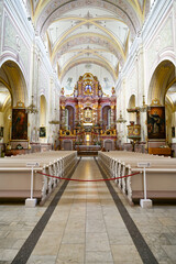 Interior view with nave, altar and pews in the centre of the Basilica of the Assumption of the Virgin Mary, Aglonas Vissvetakas Jaunavas Marijas Debesis Uznemsanas bazilika, Aglona, ​​Latvia