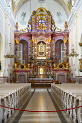 Fototapeta premium Interior view with nave, altar and pews in the centre of the Basilica of the Assumption of the Virgin Mary, Aglonas Vissvetakas Jaunavas Marijas Debesis Uznemsanas bazilika, Aglona, ​​Latvia