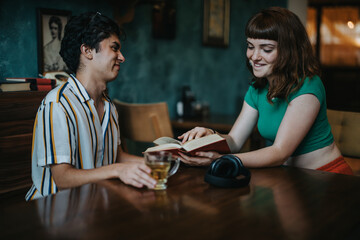 A man and woman sharing a relaxed moment reading in a warm, inviting setting with books and tea. The image captures friendship, leisure, and the joy of reading together.