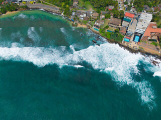 Turbulent Sea Meeting Jagged Rocks from Above