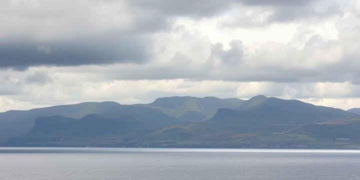 Dark grey clouds gather over the rolling hills and vast ocean, turbulent air, stormy sea