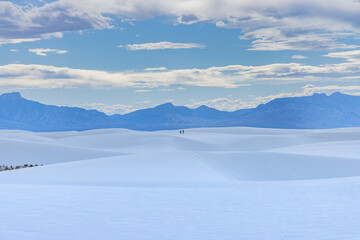 Couple walking on sand dunes in White Sands National Park, New Mexico