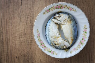  Steamed Mackerel in ceramic plate on wooden background,Thai called Plathu
