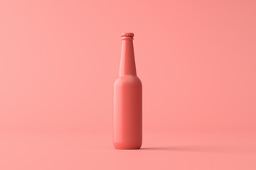 Coral pink beer bottle standing on coral pink background