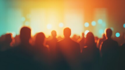 Fototapeta premium Crowd enjoying vibrant performance under colorful lights during evening event in an urban setting
