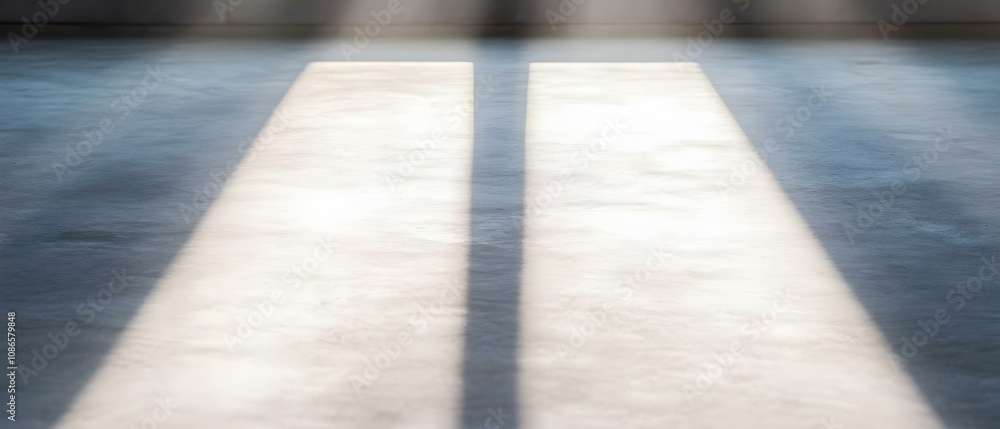 Aufkleber bright light casting long shadows on a smooth surface, creating a stark contrast between light and s